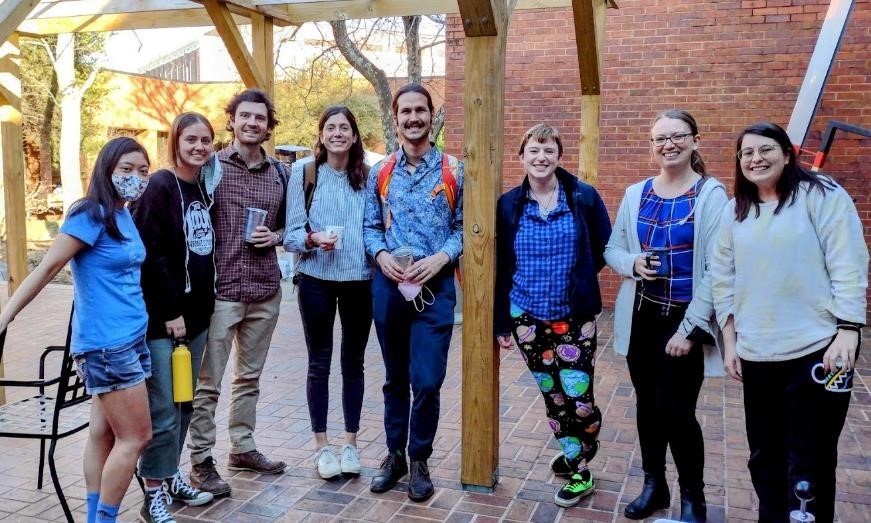Ecology graduate students standing in the Ecology courtyard during a break from the 2022 Graduate Student Symposium. Photo: Sonia Altizer.