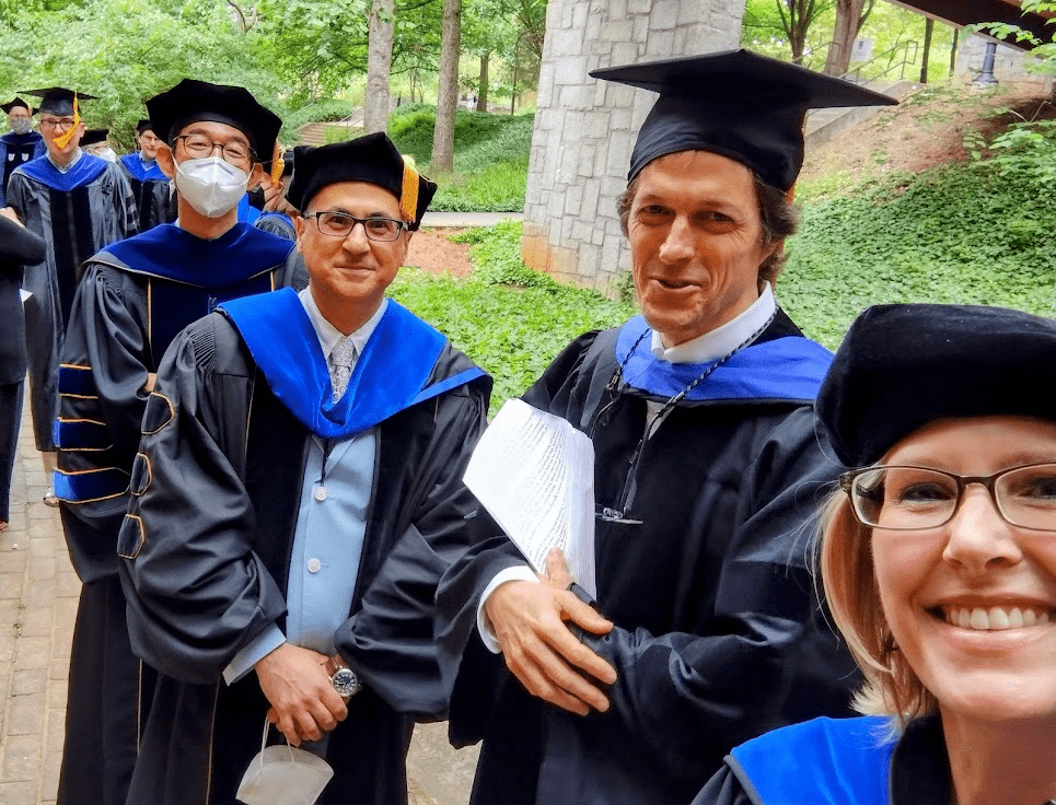Faculty members in academic regalia lining up for the convocation processional on May 13, 2022. Photo: Sonia Altizer.rocess